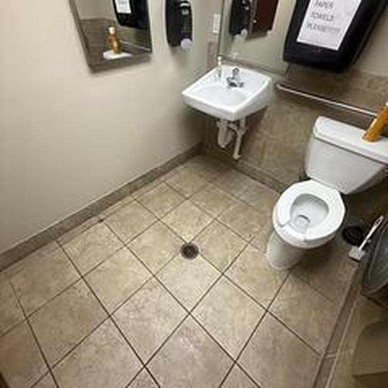 Floor drain clearing in commercial restroom