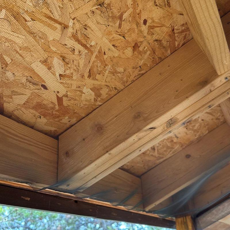 Roof soffit wooden framing with mesh installation