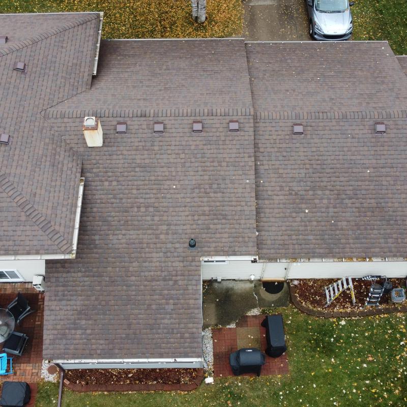 Asphalt shingle roof with vent and chimney view
