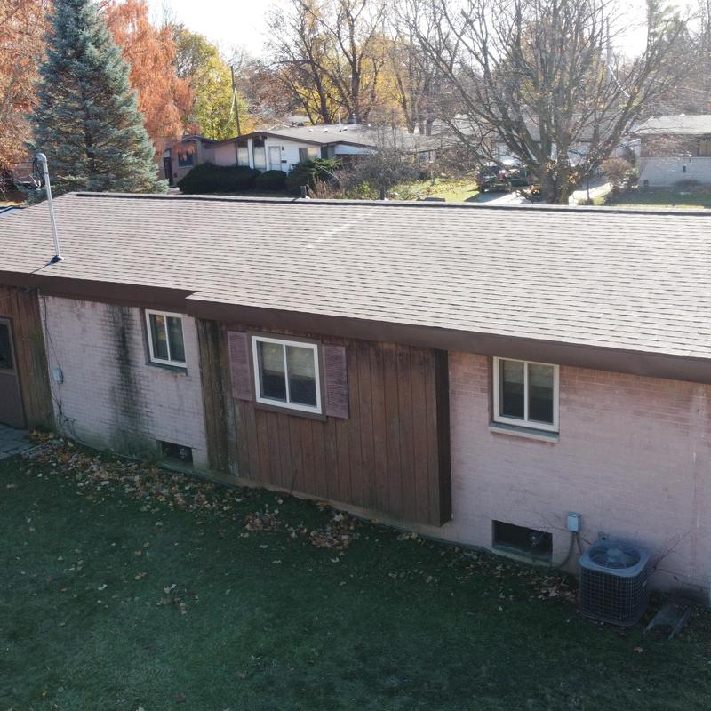 Asphalt shingle roof with new aluminum soffit and gutters