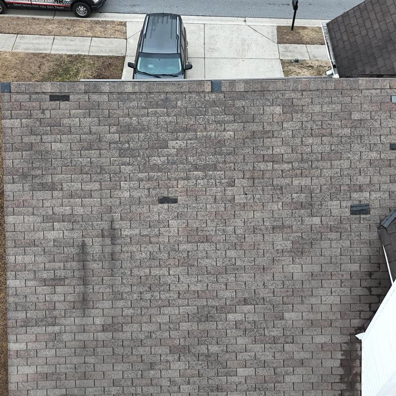 3-tab roof with missing shingles near driveway driveway