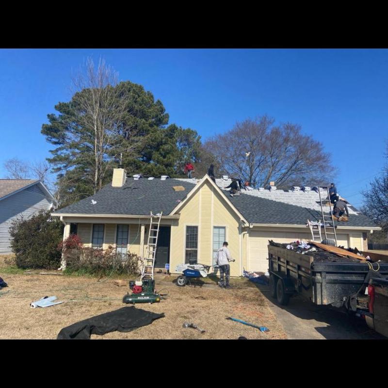 Architectural shingle roof installation on residential house Architectural shingle roof installation on residential house