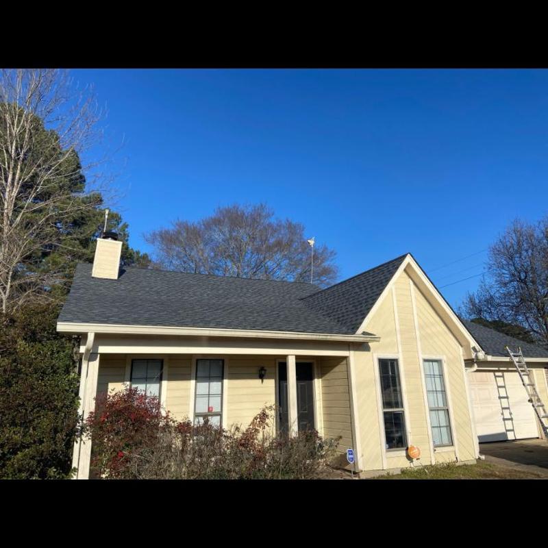 Architectural shingle roof installation on house exterior Architectural shingle roof installation on house exterior