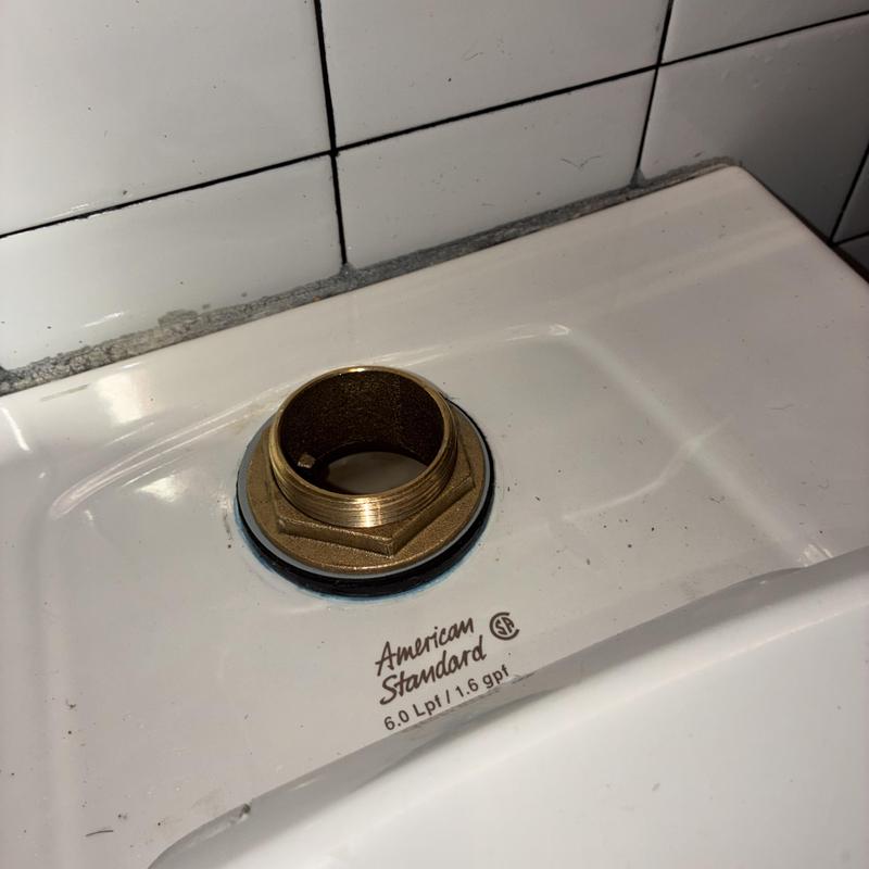 Flush valve spud on ADA toilet in commercial restroom