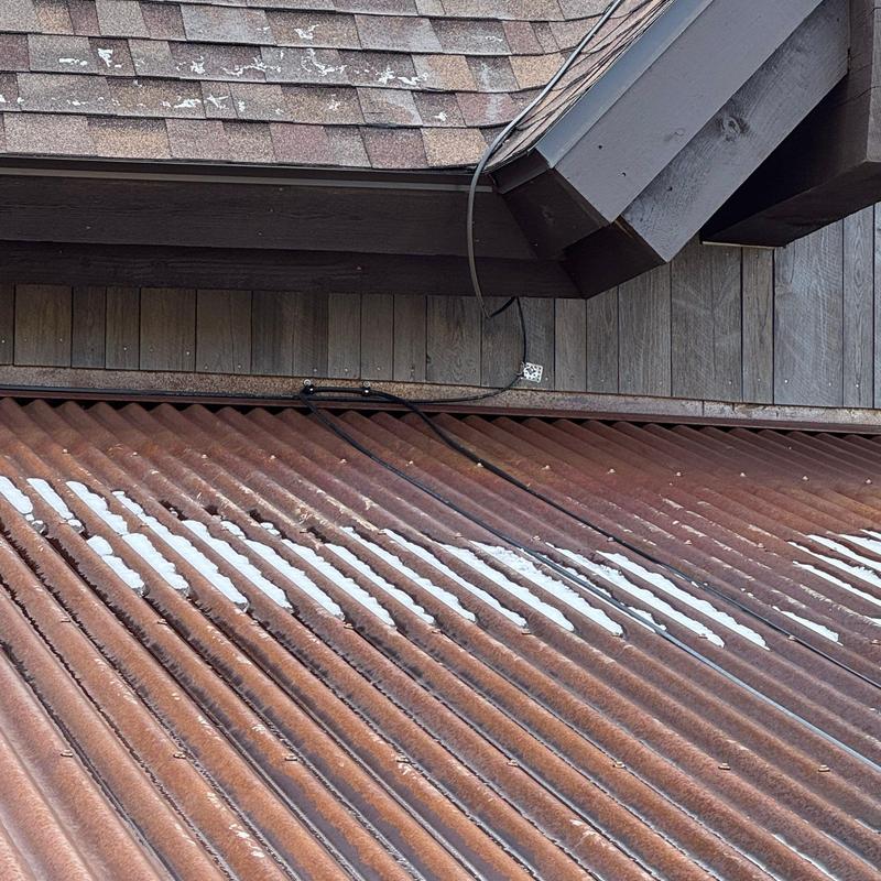 Corrugated corten metal roof with heat tape installed