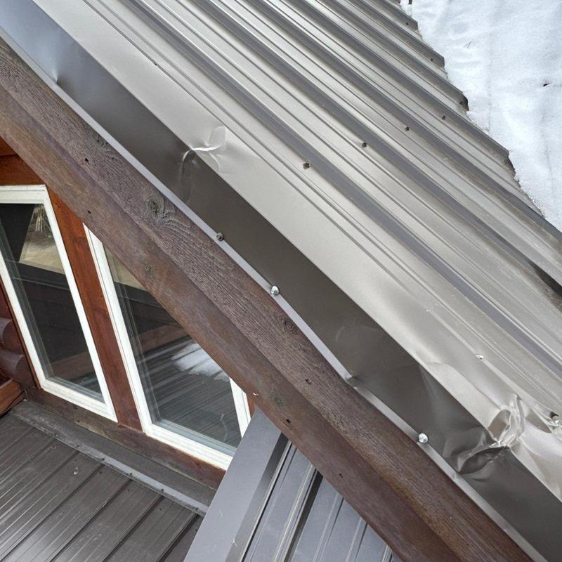 Metal roof panels with dents and flashing damage