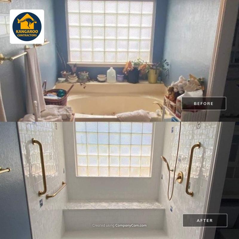 Accessible shower with frameless enclosure and brass fixtures Accessible shower with frameless enclosure and brass fixtures