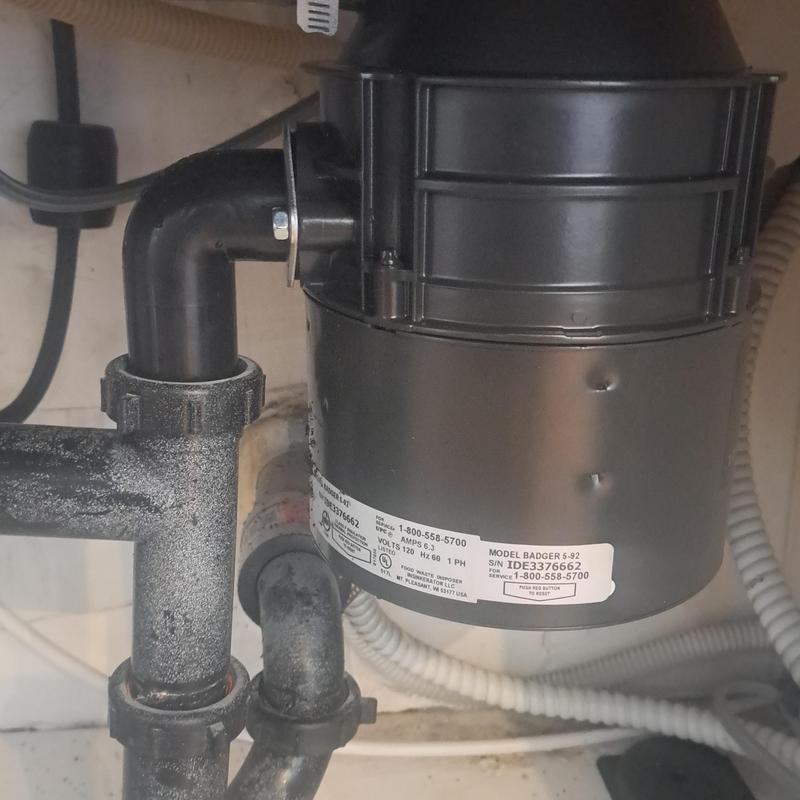 Garbage disposal unit under kitchen sink installation