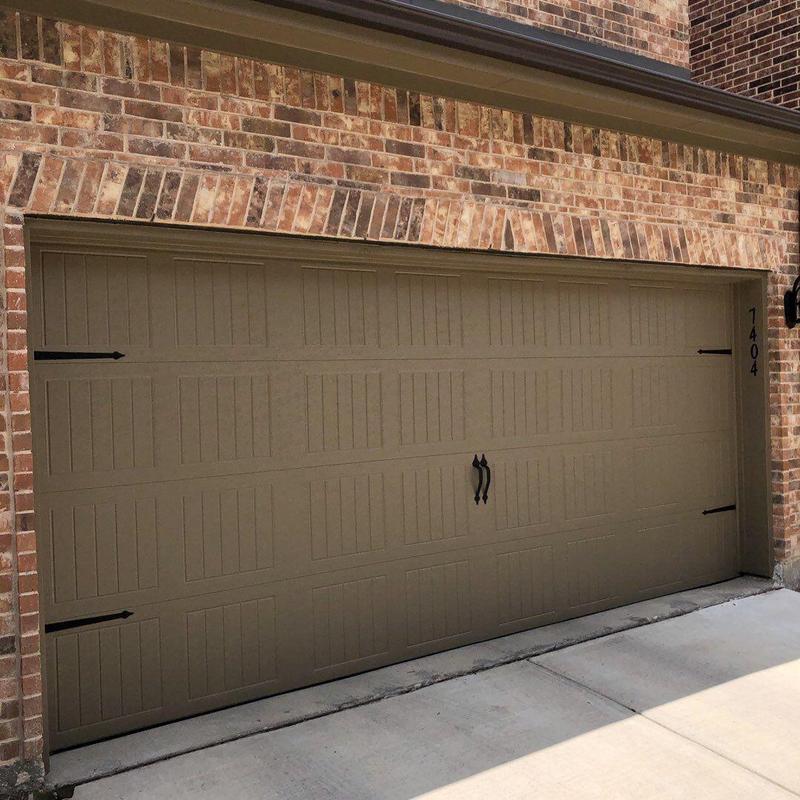 Insulated garage door with decorative handles installed