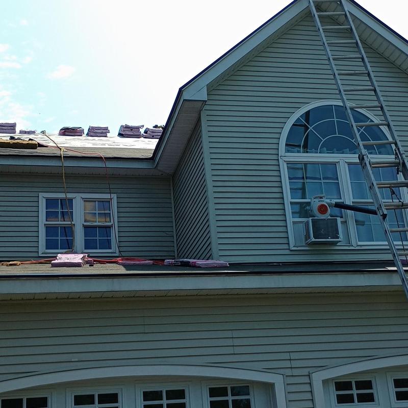 Asphalt shingle roof installation on residential home