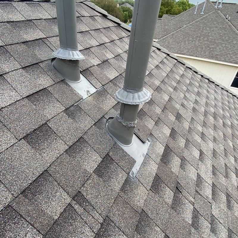 Asphalt shingle roof with pipe flashing installation
