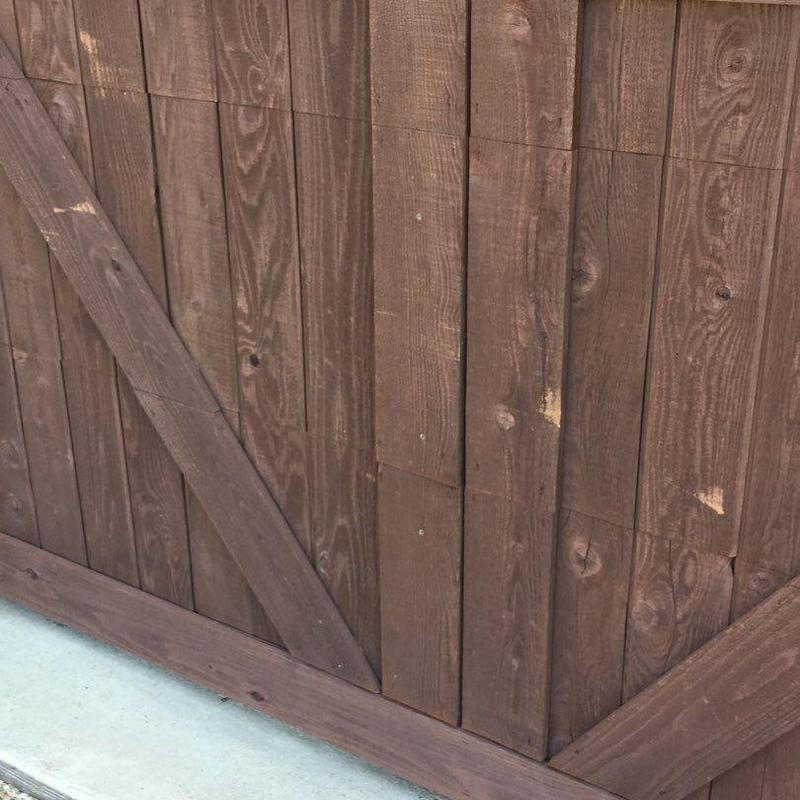 Wood garage door with fresh stain in Prosper TX