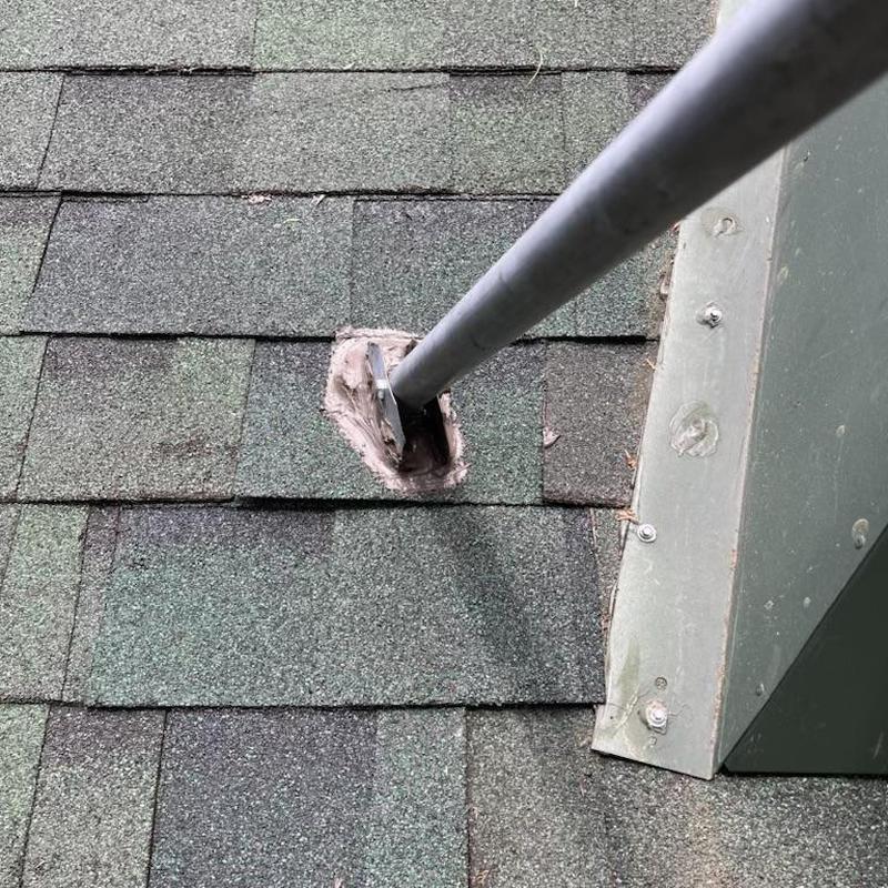 Roof pipe flashing with replaced shingles and braces