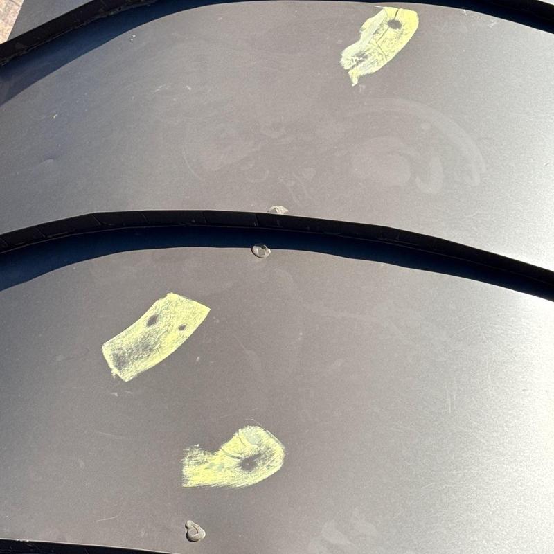 Roof metal panels with hail damage marks