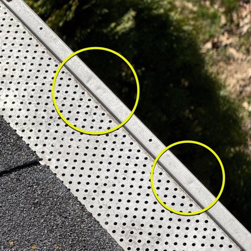 Metal drip edge flashing with dent marks on roof edge