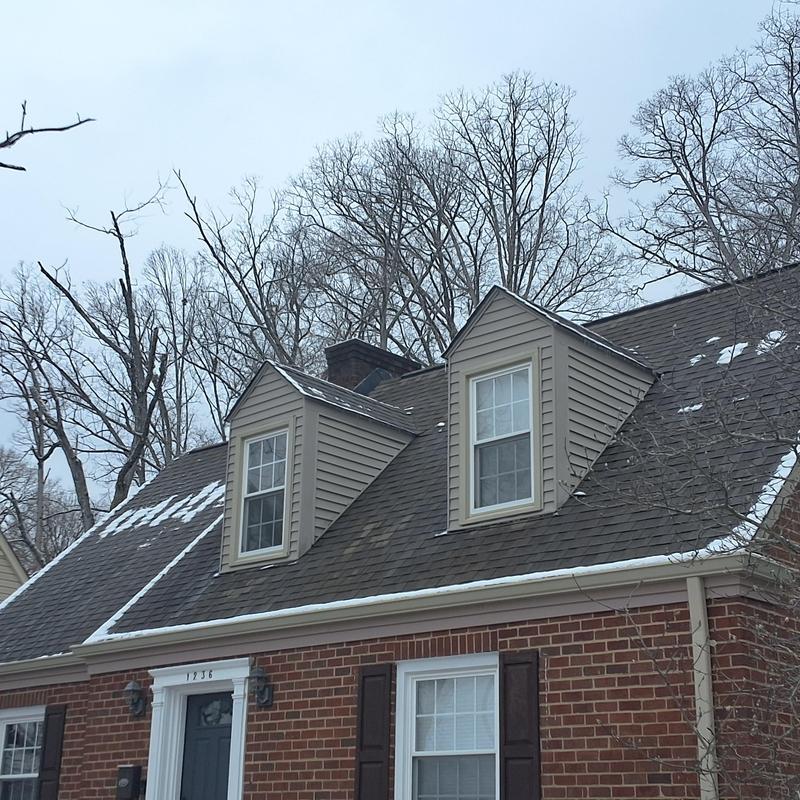 Atlas shingle roof with dormer windows in winter