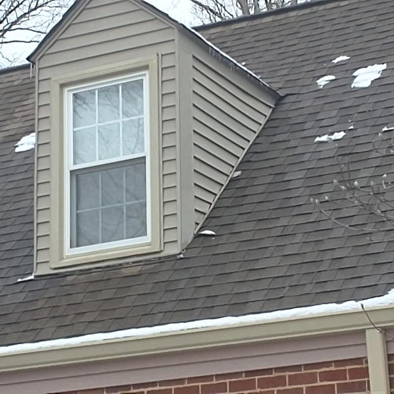 Atlas shingle roof with dormer and light snow patches