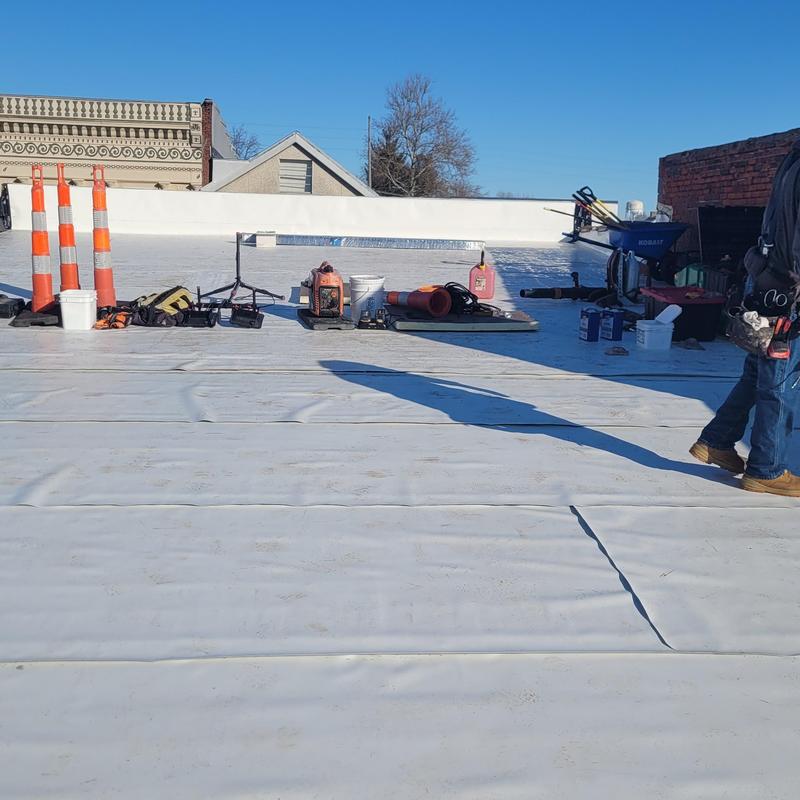 PVC single ply roofing installation on commercial roof