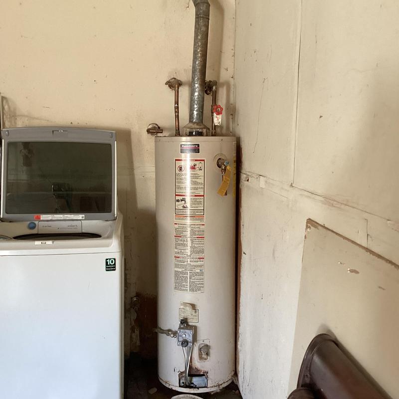 40-gallon gas water heater on concrete floor