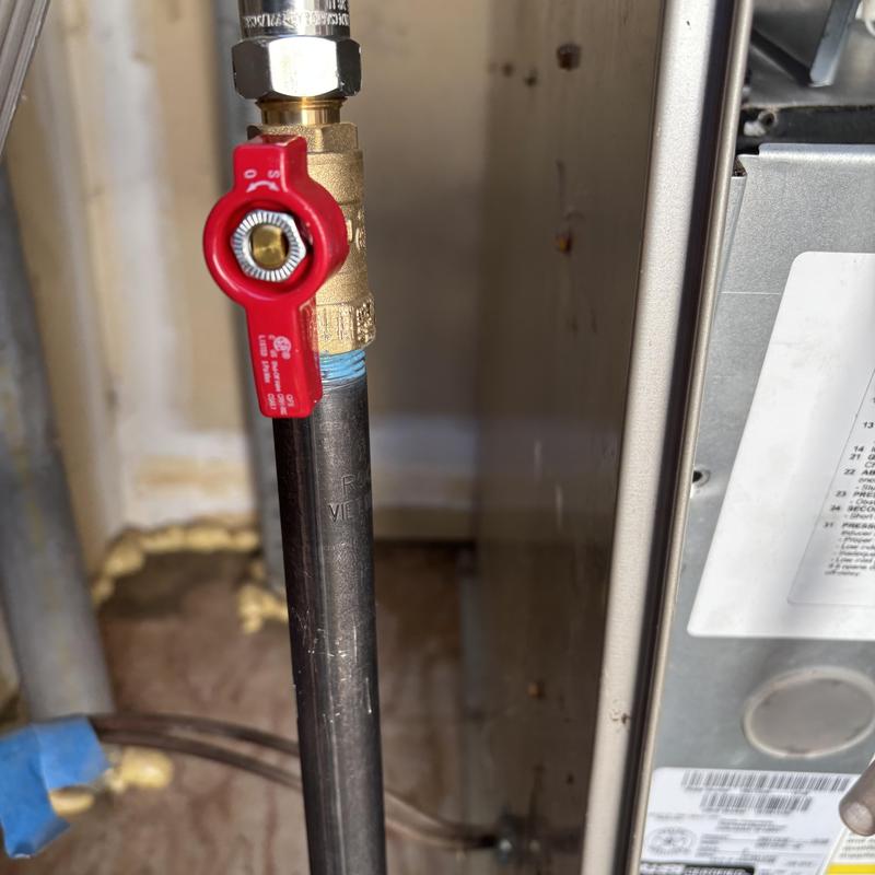 Gas valve and red handle on furnace piping