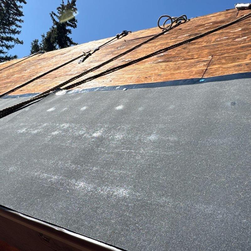 Ice and water shield installation on wooden roof deck