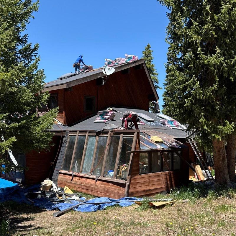 Asphalt shingle roof with replacement prep and workers