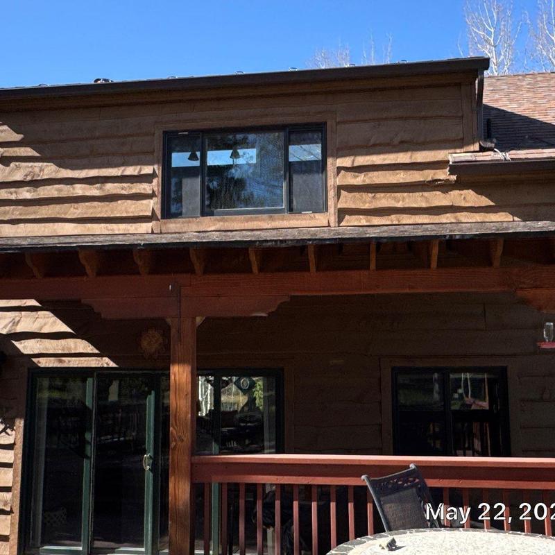 Asphalt shingle roof with wood deck and railing