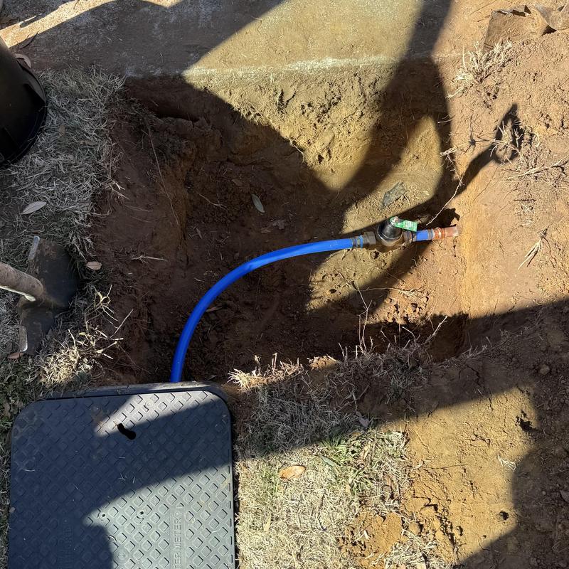 Water meter and pipe connection with valve in dirt hole Water meter and pipe connection with valve in dirt hole