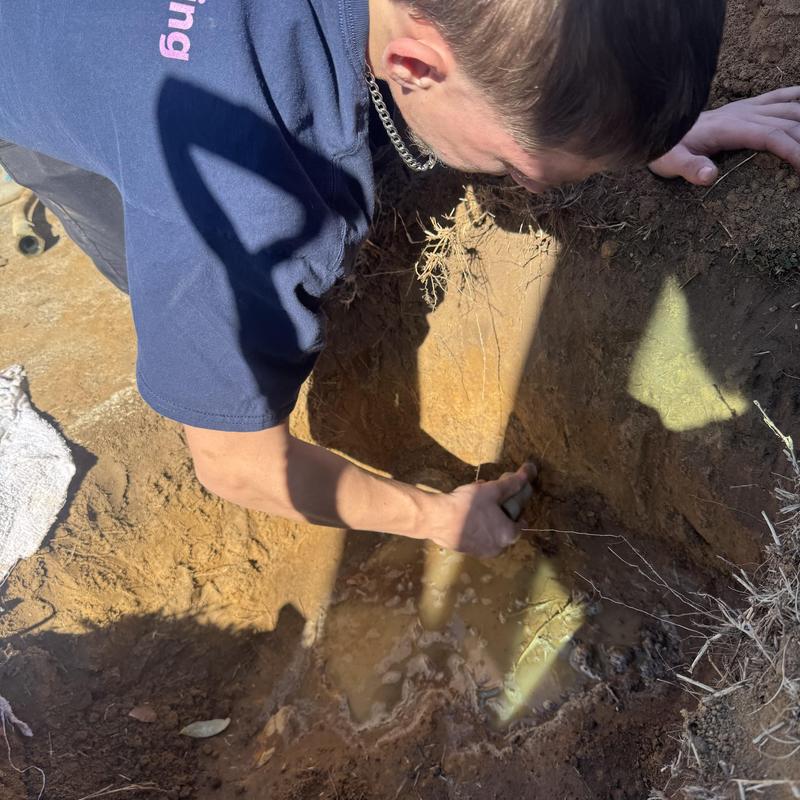 Water line excavation for plumbing repair outdoors Water line excavation for plumbing repair outdoors