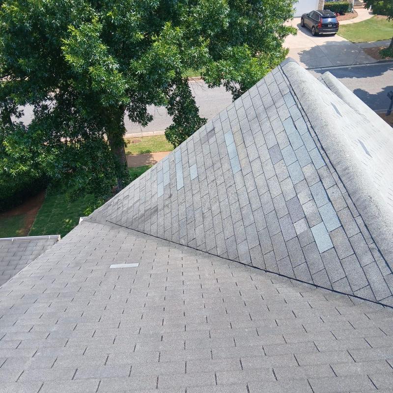 Roof shingles with replaced damaged sections and power vent