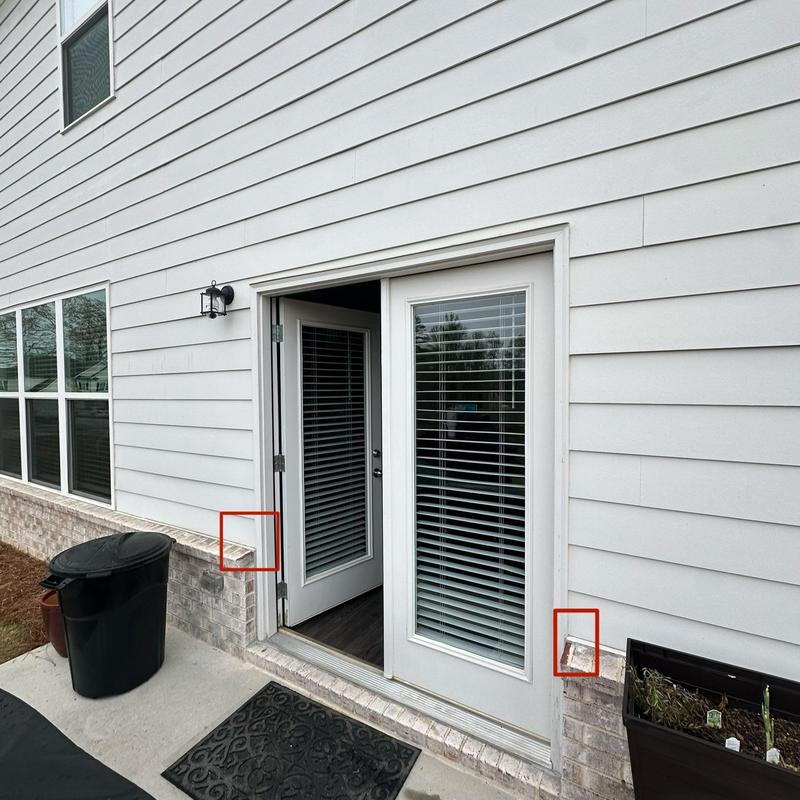 Brick flashing near back door showing water damage