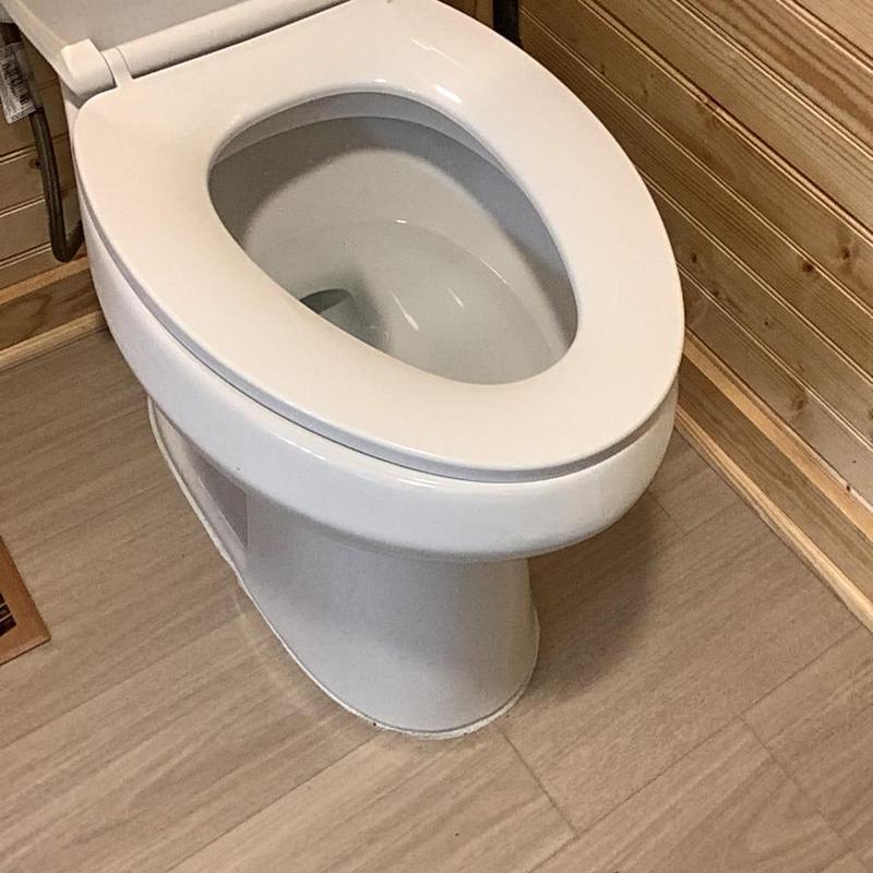 Toilet bowl removed for drain line access