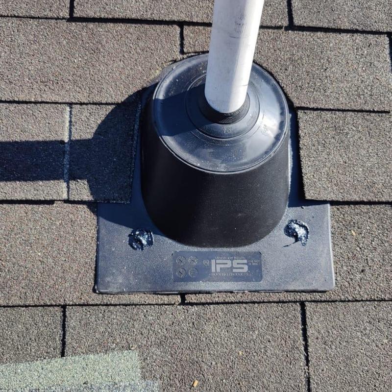 Pipe boot on shingle roof with new caulking