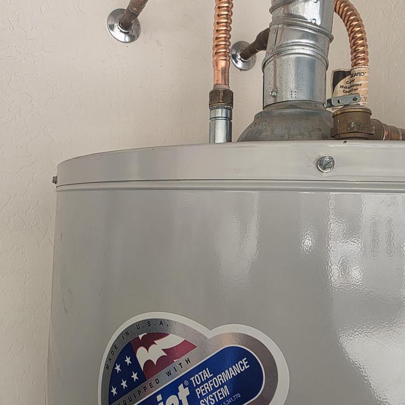 Water heater with copper piping and vent pipe details