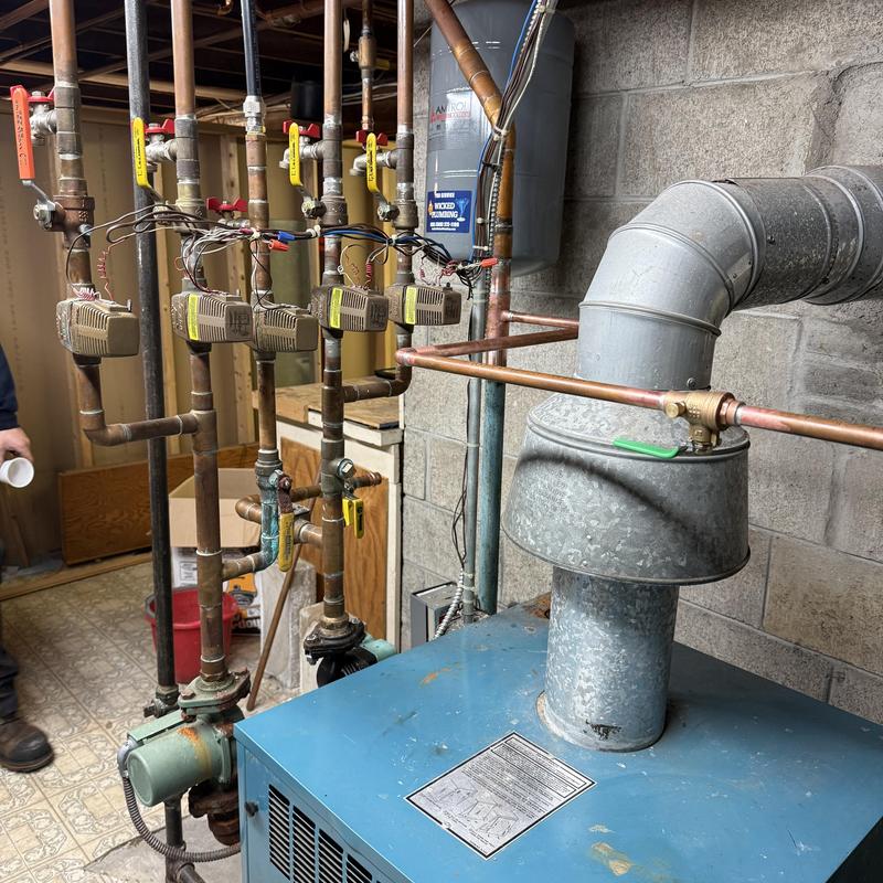 Boiler ventilation pipe and copper valve system in basement