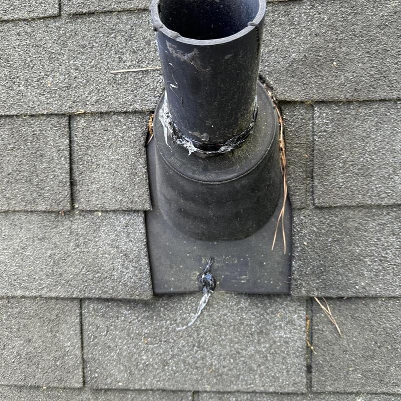 Roof vent pipe flashing with sealant on shingles