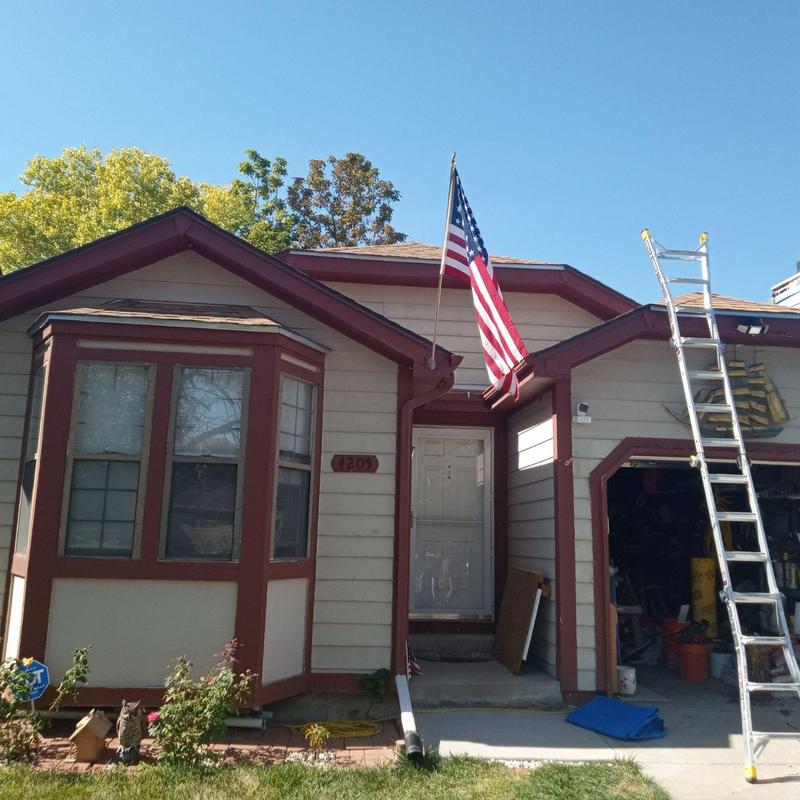 Roof shingles hail inspection with ladder at house Roof shingles hail inspection with ladder at house