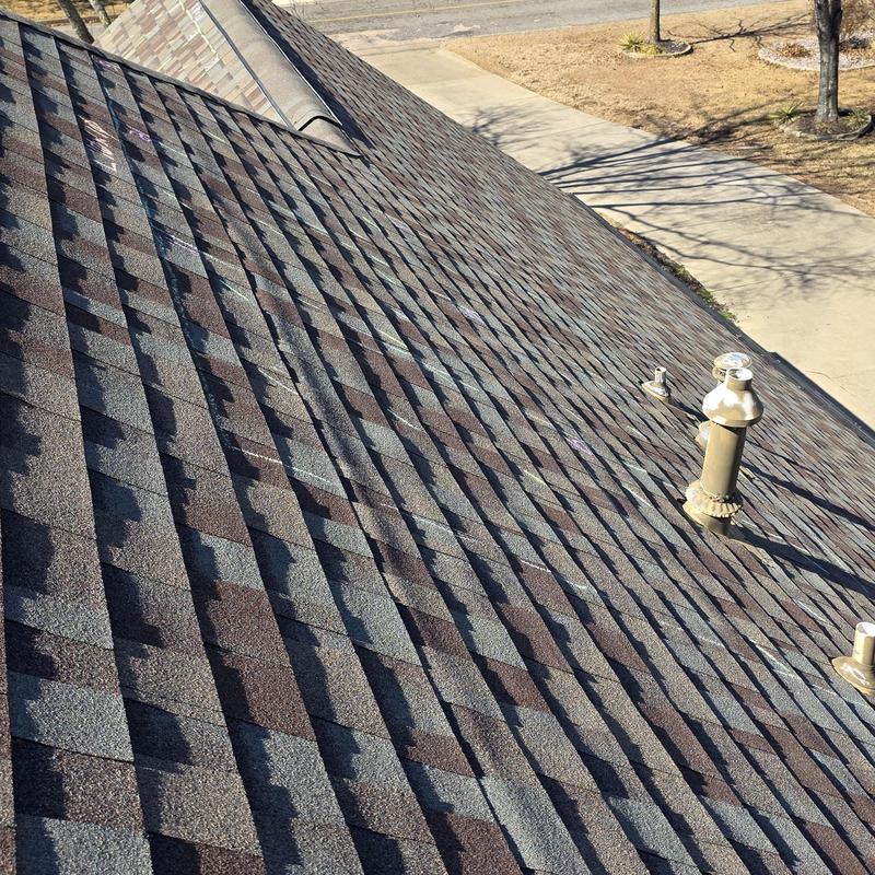 Asphalt shingle roof with vent pipes inspection markings