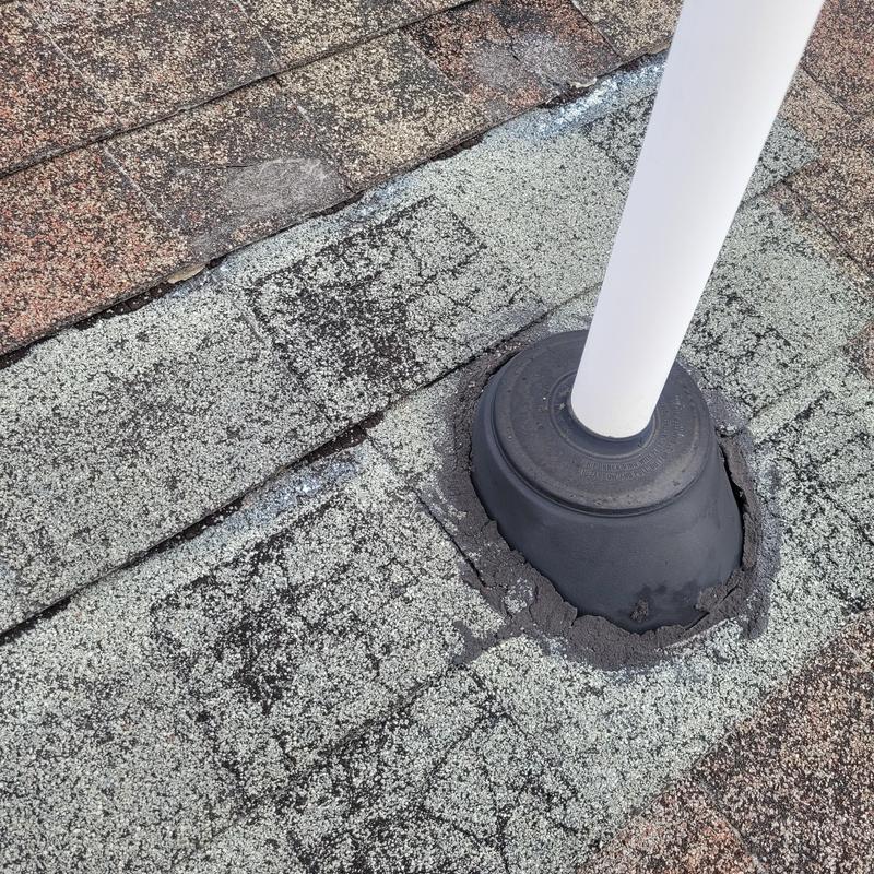 Roof vent flashing with sealant on worn shingles