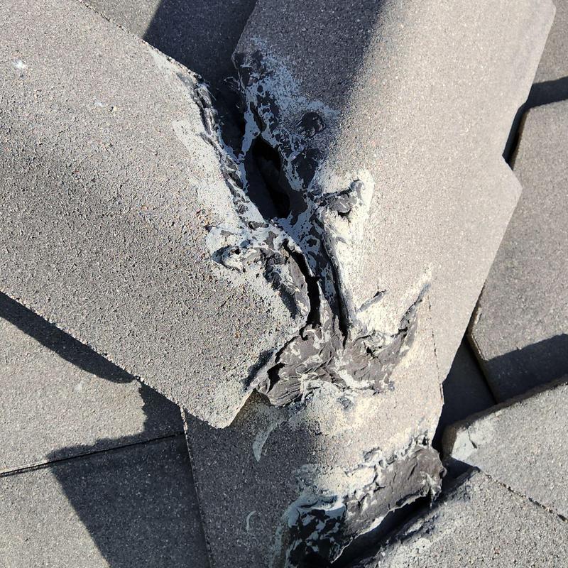 Tile roof ridge with cracked sealant and damage Tile roof ridge with cracked sealant and damage