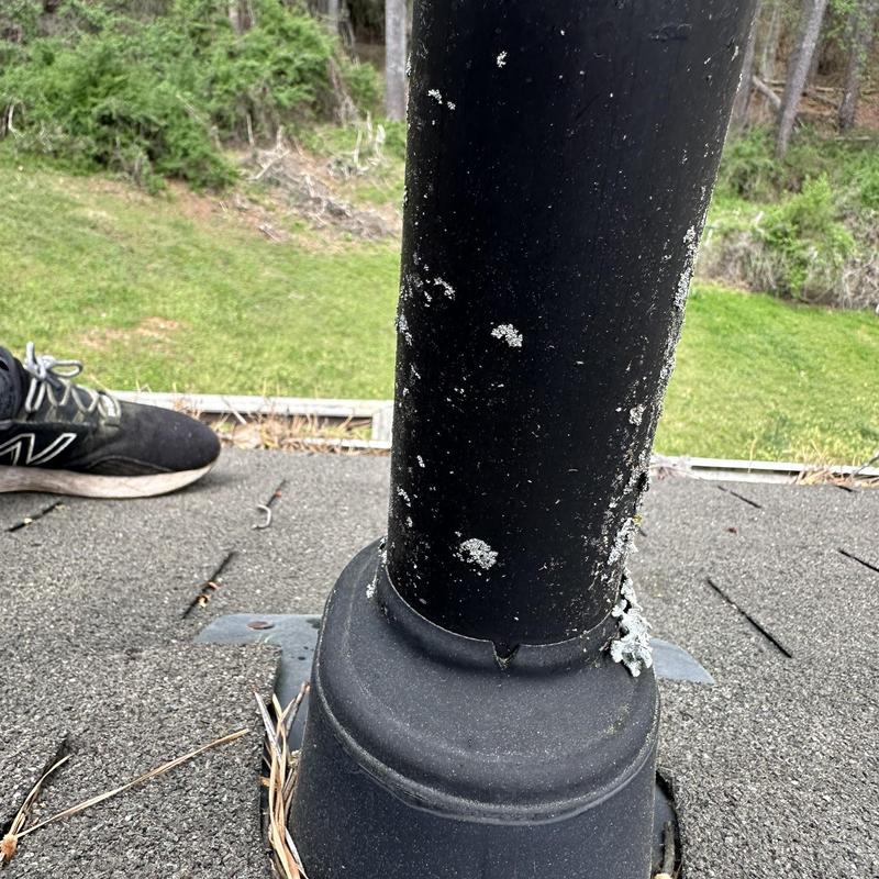 Pipe boot on roof with cracks and deterioration