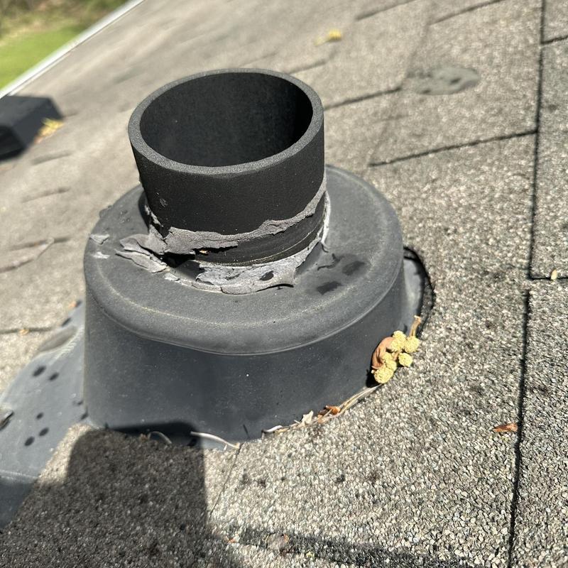 Roof pipe boot with cracked seal and damaged flashing