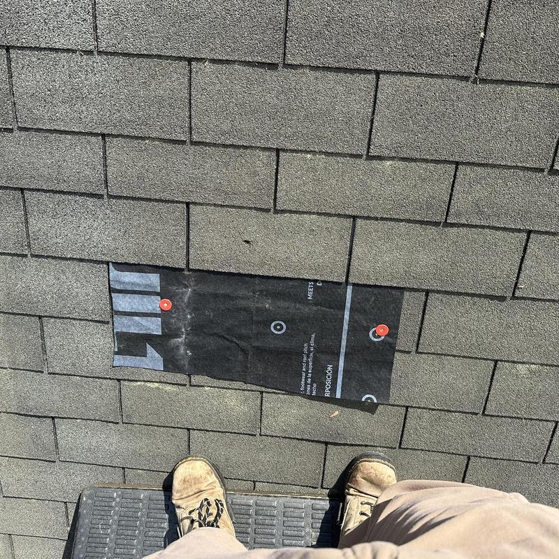 Roof shingles underlayment patch with nails on asphalt roof