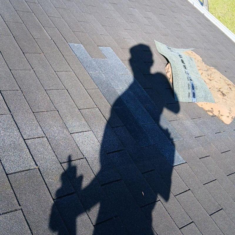 Damaged roof shingles with partial replacement and new caulk