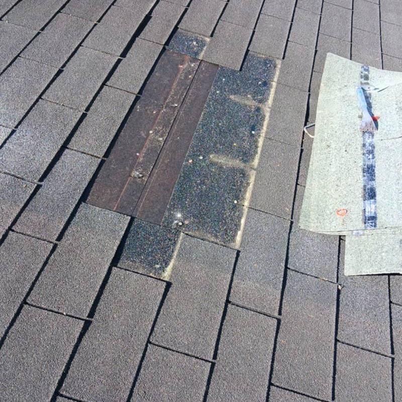 Damaged asphalt shingles replaced on residential roof