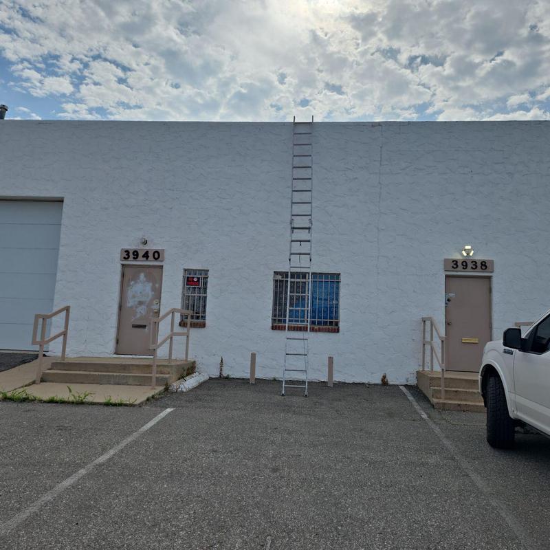 Flat roof ladder access at warehouse exterior Flat roof ladder access at warehouse exterior