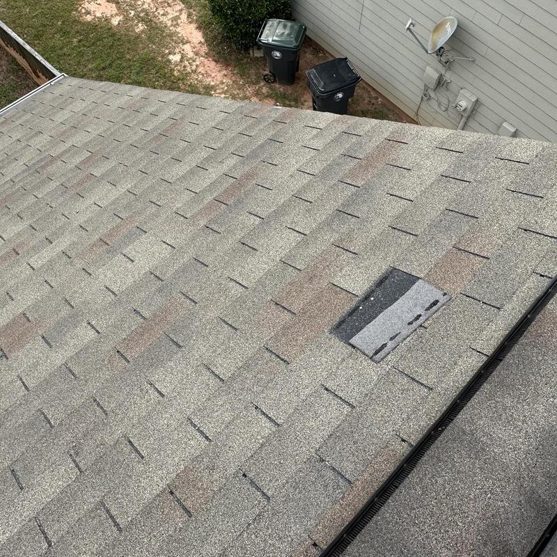 Roof shingles with one replaced shingle patch