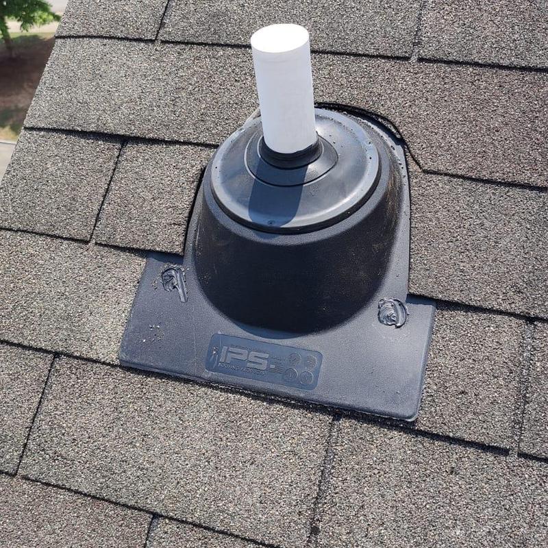 Pipe boot and shingle roof with caulked seal