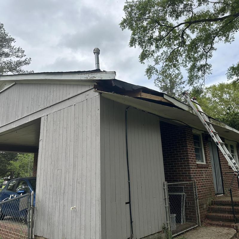 Roof decking and soffit damage from tree limb impact