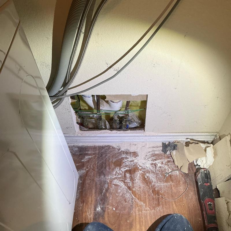 Hot water line reroute overhead with wall access cutout